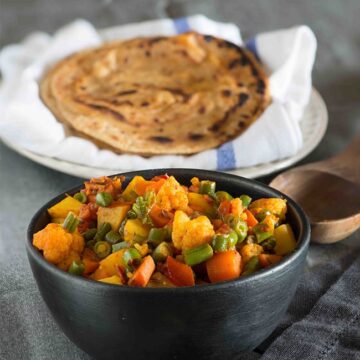 Mixed vegetable sabzi or mixed vegetable curry is simple home style punjabi curry to serve with Roti and paratha. Recipe of mixed vegetable sabzi is very simple but it makes for a very hearty curry, especially in winters, when we get very good fresh produce in North India