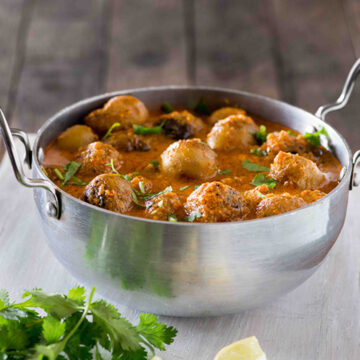 Kashmiri dum Aloo is a dish from the Kashmiri cuisine that is made with baby potatoes in a rich and spicy curry. Also known as Dum Olav or Dun Aloo, Kashmiri dum aloo is served with rice
