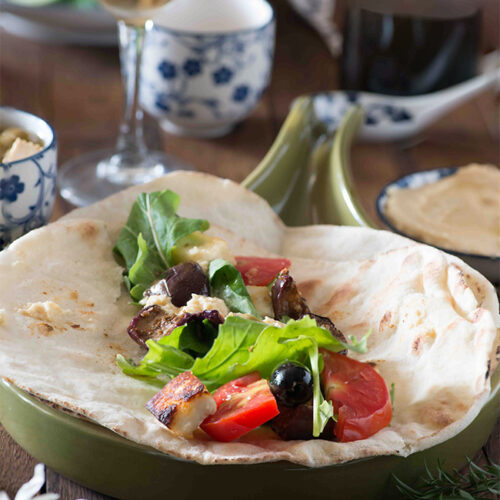 Lebanese eggplant and cheese wrap is an assortment of fresh veggies and H along with za'atar fried eggplant wrapped in an Arabic bread. These wraps are mostly enjoyed and served for the breakfast in the middle east.