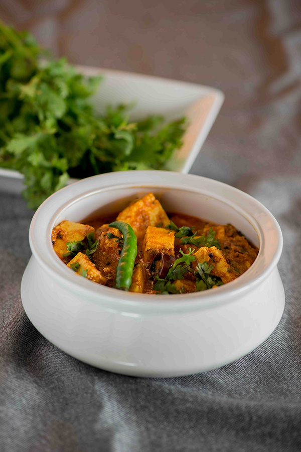 Achari paneer curry recipe that is tangy and has a zesty flavours from achari masala or Indian pickling spices. This a no onion no garlic paneer curry recipe with very flavourful and creamy gravy. This aromatic paneer curry that is served with Chapati rice or paratha