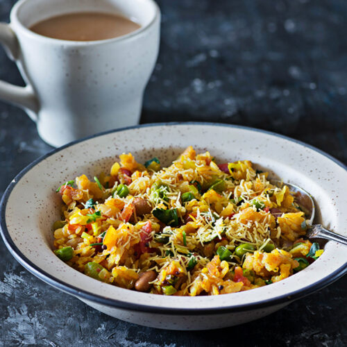Vegetable Poha is popular and healthy Indian breakfast dish made with flattened rice and lots of vegetables. From as long as I can remember vegetable poha been a comfort breakfast or sometimes just a small portion of poha with evening tea was served as a part of Indian chai Nashta, especially during the weekends.