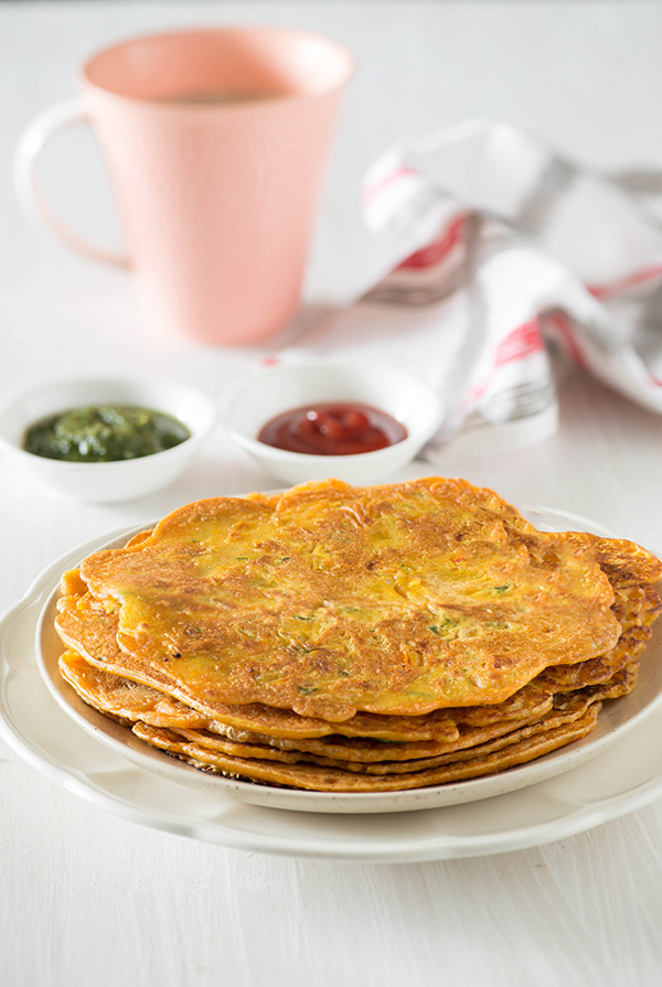 Besan Cheela is tasty and healthy Indian breakfast recipe. Besan ka cheela is also known as Besan ka puda or vegetarian omelet. It is naturally gluten free, vegan and low GI breakfast option. Serve it with green chutney and a chilled glass of chaach or masala chai for a quick tasty and healthy breakfast.