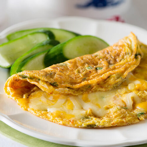 Indian Masala omelette recipe perfect for breakfast, lunch or even dinner. Eat the masala omelete on its own, or add vegetables, spices, and cheese of your choice to make it even better. Masala omelette is the easiest meal on go for me and mostly serve it up with a side of veggies either stirred or simple green salad. WhenI am feeling more indulgent, A crispy paratha along with it serves the purpose alright.