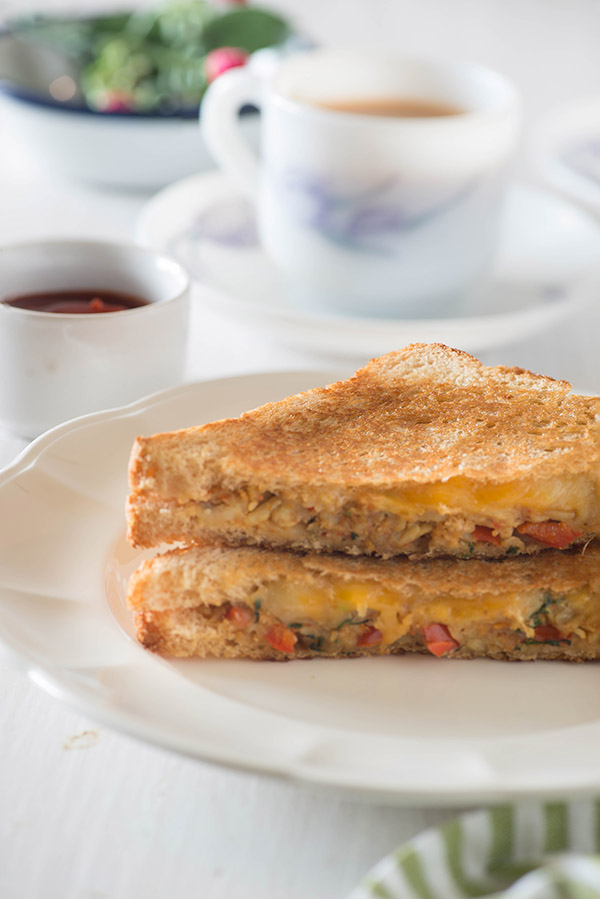 Crispy, buttery hot Capsicum Masala cheese grilled sandwich on a rainy day or a wintery evening, is almost perfect sort of evening snack idea for me or dinner if I just skip the chai, and replace that with hot and steaming bowl of homemade tomato soup. 