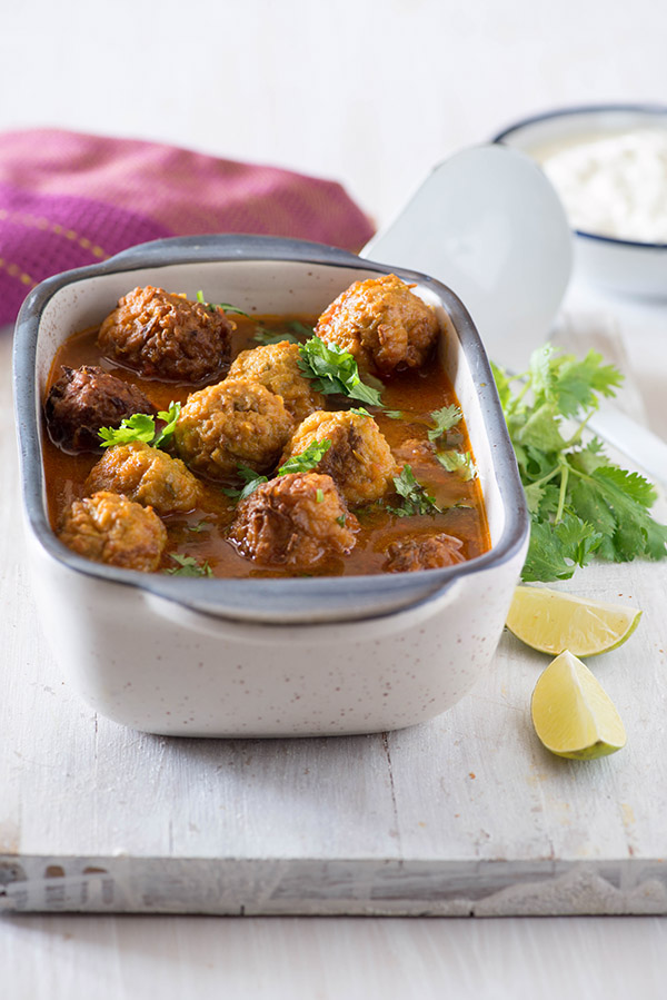 Lauki Kofta curry is tomato-based vegetarian curry from Indian cuisine. Lauki Kofta made with bottle gourd and gram flour are cooked in a light brothy but spicy curry.