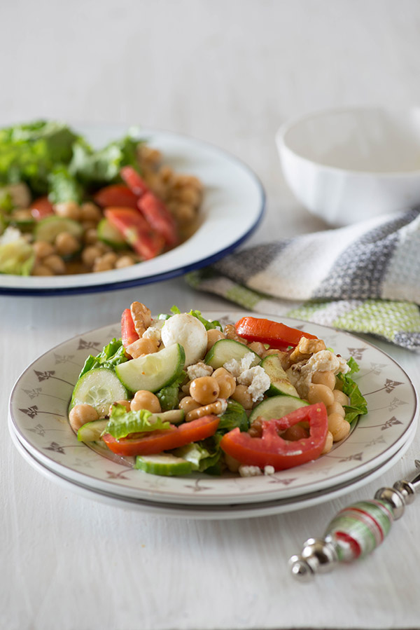 Greek Chickpeas salad is Refreshing salty with lots of Feta cheese, crunchy vegetables with Chickpeas and a super simple vinaigrette dressing makes it an easy light meal or a refreshing side dish.
