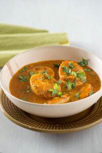 In Coconut masala egg curry, boiled eggs are cooked in roasted coconut gravy which is fragrant and thick. Coconut egg curry tastes absolutely best with either Malabar parotta, laccha paratha or tava roti. There are many versions of coconut egg curry, you can make Kerala style egg curry, you can make Sri Lankan egg curry in which gravy is made with thick coconut milk