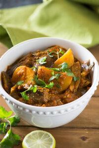 Aloo baingan sabzi is tasty curry from North India. Eggplant and Potatoes are cooked in a tangy gravy with aromatic spices for this no onion no garlic tasty curry