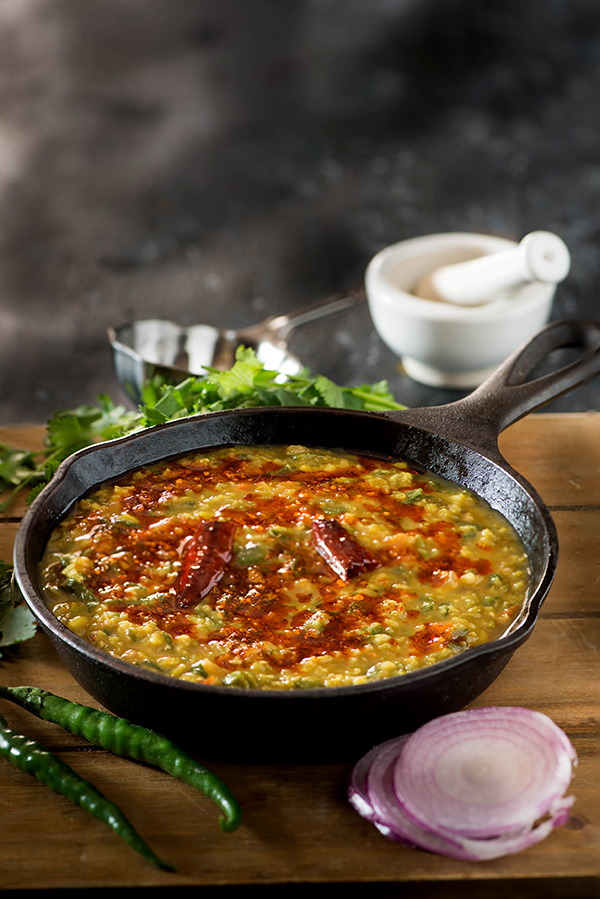 Punjabi Dal Palak is smoky spicy and super healthy dal recipe. Also known as spinach dal the dal palak recipe is easy way to add more health quotient to your everyday Indian meals. Tempering or tadka is what makes this super delicious.