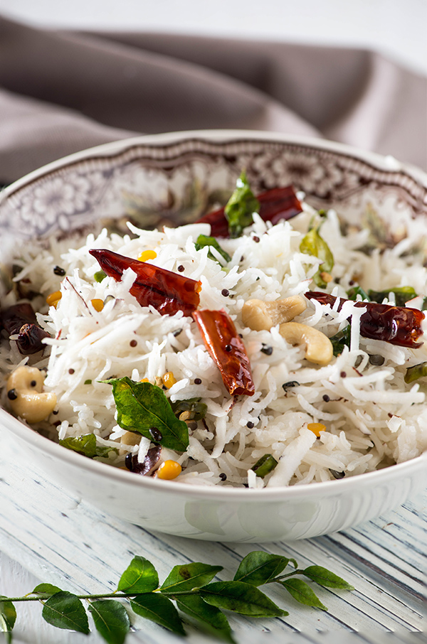 coconut rice recipe is fragrant, aromatic and one of my favourite side dish ! These days I make it in instant pot , electric pressure cooker any other pressure cooker. All It takes is 20Minutes. Cooked with fresh tender coconut and lots of aromatic, this is the perfect side dish for any Indian curry.