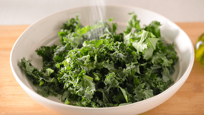 Add salt to kale for massaging