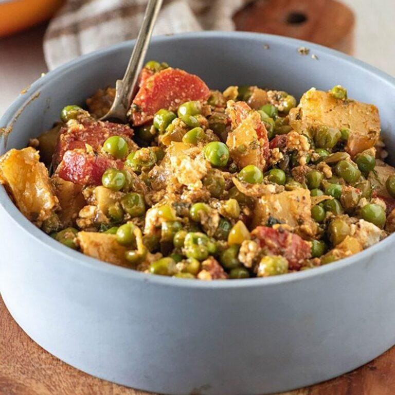greek potatoes and peas recipe image