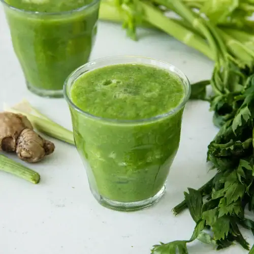 best detox smoothie for weight loss in a glass with apple spinach and celery